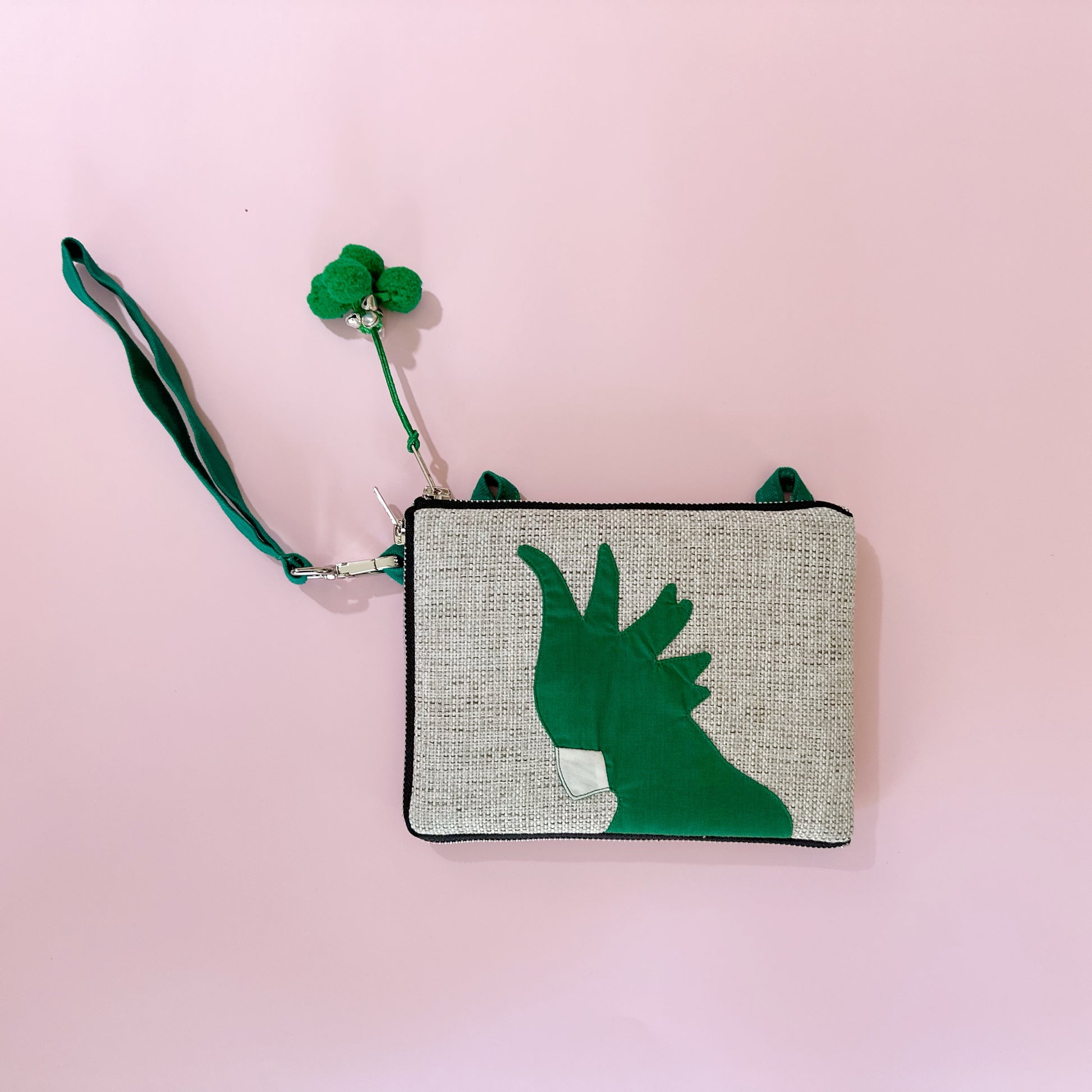 jute cockatoo crossbody bag in green flatlay