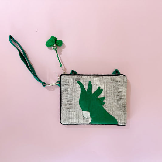 jute cockatoo crossbody bag in green flatlay