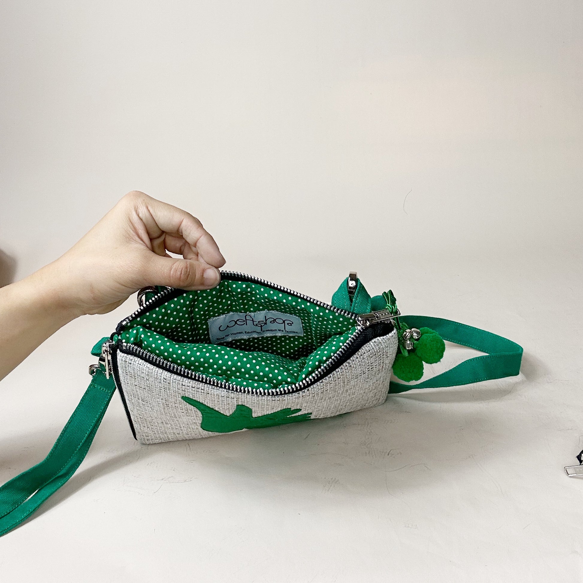 jute cockatoo crossbody bag in green opened