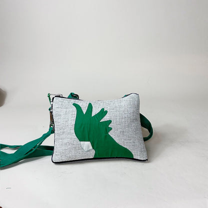 Green and gray pouch with a cockatoo design on a white background